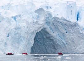 Zodiacs cruise in front of Petzval Glacier (Antarctic Peninsula)