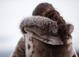 Young Inuit women wearing a traditional seal parka (Greenland)